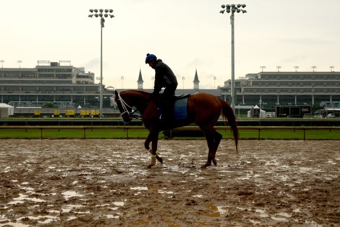 A horse is brought onto the track during a morning exercise session at Churchill Downs amid wet weather earlier in the week.