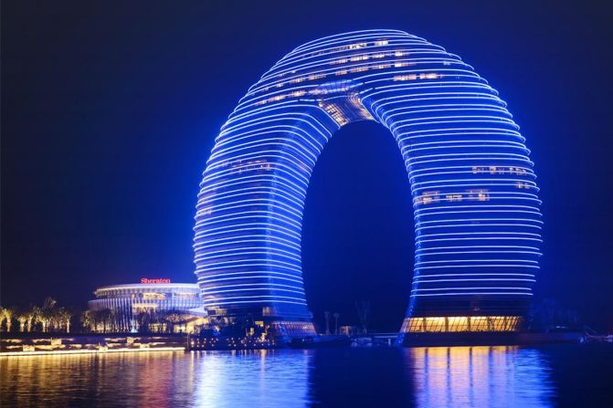<strong>Sheraton Huzhou Hot Spring Resort, Huzhou</strong><br /><strong>Architect: </strong>MAD architects<br /><strong>Status: </strong>Opened in 2013<br /><strong>Rooms: </strong>321<br /><strong>Fast fact:</strong> Constructed of "layers" of floors to create a ring that rises from the south bank of Huzhou's Taihu Lake, this $1.5 billion Sheraton hotel received a lot of attention on its opening for its unusual design. The local region is known for its beautiful scenery, which includes hot springs and bamboo forests; scenes from Oscar-winning "Crouching Tiger, Hidden Dragon" were filmed in Huzhou. <br /><a href="index.php?page=&url=http%3A%2F%2Fwww.starwoodhotels.com%2Fsheraton%2Fproperty%2Foverview%2Findex.html%3FpropertyID%3D3414" target="_blank" target="_blank"><em>Sheraton Huzhou Hot Spring Resort</em></a><em>, No. 5858 Taihu Road, Huzhou, Zhejiang, China; +86 572 2299 999</em>
