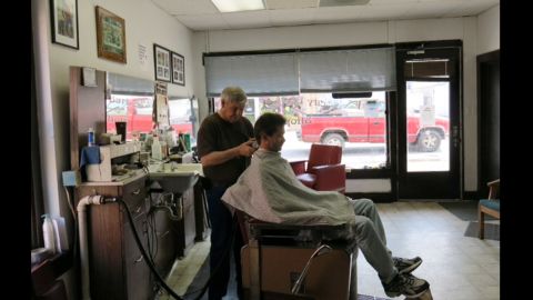 George Robinson has clipped hair in Lake City for 43 years. He's for the project "if it materializes like it's supposed to."
