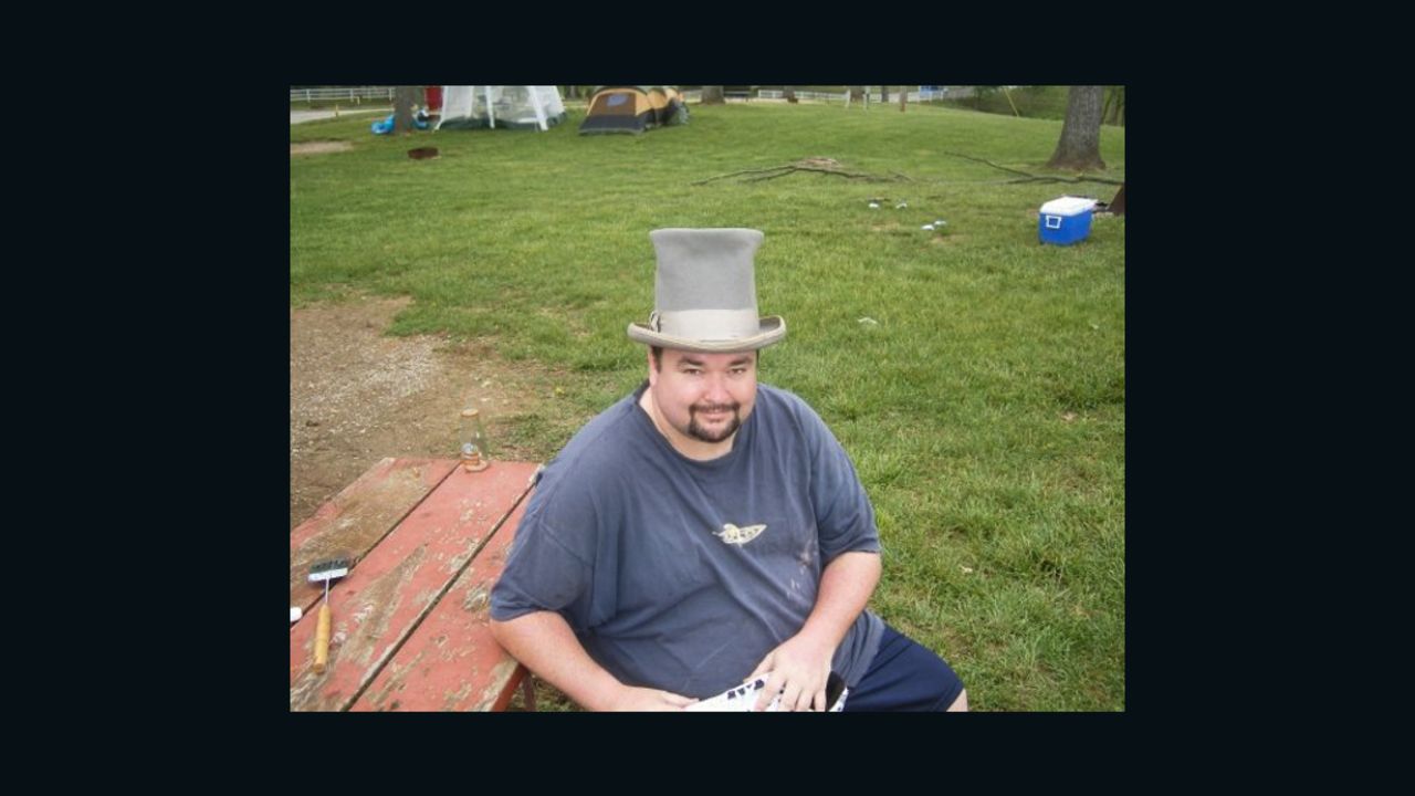 Photographer John McGraw occasionally wears a top hat to the Kentucky Derby.