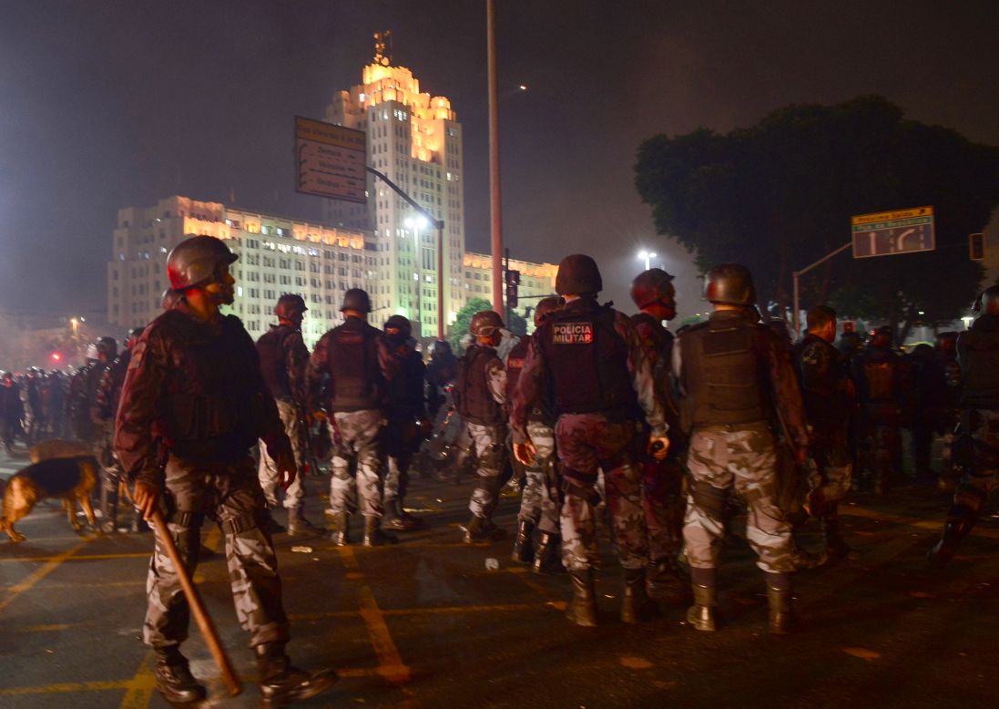 Police prepare for a long night of clashes with protesters.
