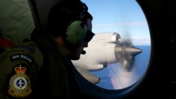 :FLTLT Jamin Baker, a crew member of a Royal New Zealand Air Force P-3 Orion on lookout whilst taking part in the search trying to locate missing Malaysia Airways Flight MH370 over the southern Indian Ocean on April 11, 2014.