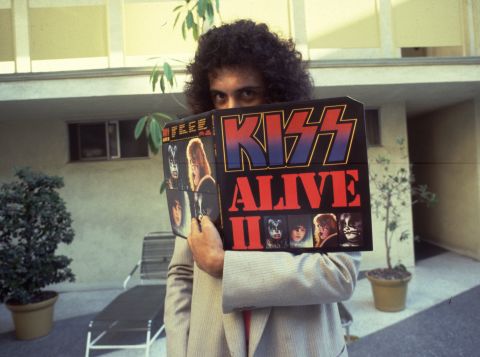 The band's chart success was based on constant and energetic touring -- concerts that were then turned into some best-selling live albums. In 1977, the band released "KISS Alive II," displayed here by a coy Simmons.