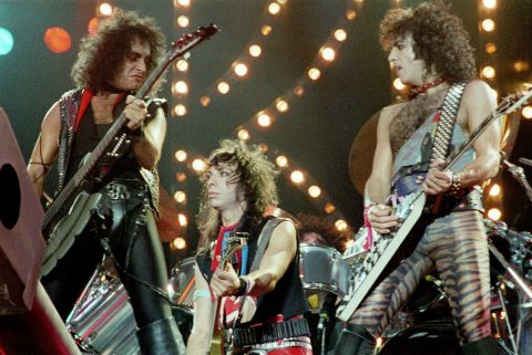 In late 1983, the band decided to go without its famous makeup, first in an appearance on MTV and then on tour. Simmons had trouble coping. "(I) didn't know how I was supposed to act, because the non-makeup version of the band was an entirely new idea," he wrote in his book, "Kiss and Make-Up." From left, Simmons, Vincent and Stanley play London's Wembley Arena in 1983. 