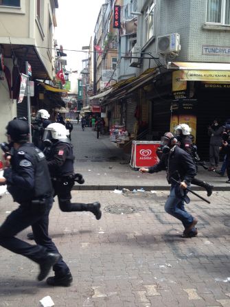 Police charge along the streets. "The sad thing is, in 2012 the Turkish government allowed labor unions and leftist parties to hold a rally in Istanbul's Taksim Square," says Watson. "That was a peaceful May Day attended by tens of thousands. For the last two years, the state has banned rallies there and the result has been violence, riots and police crackdown."