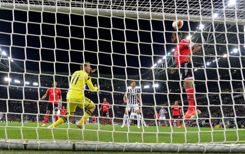 Veteran Benfica defender Luisao clears Arturo Vidal's header off the line to keep the score at 0-0 as Juve pushed hard for the goal they needed.