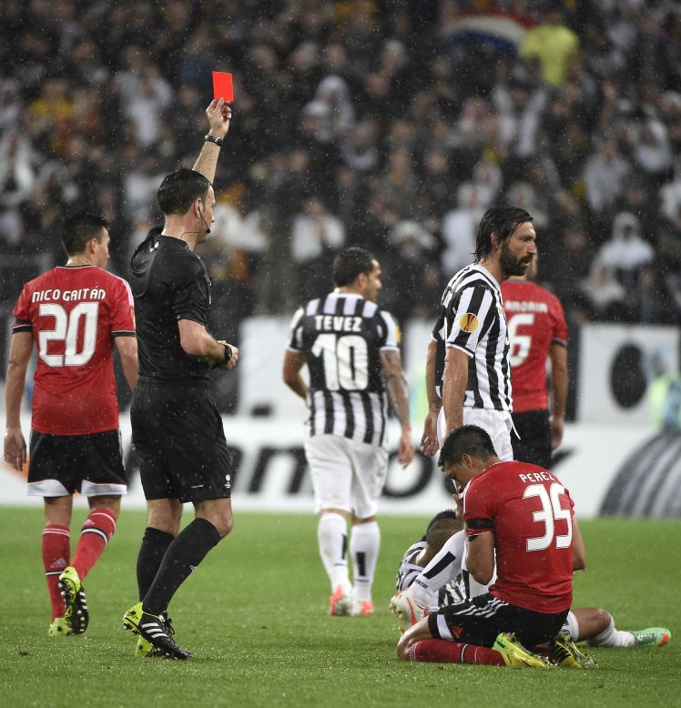 Benfica's Enzo Perez is shown a red card by referee Mark Clattenburg, giving Juve renewed hope with 20 minutes to go.