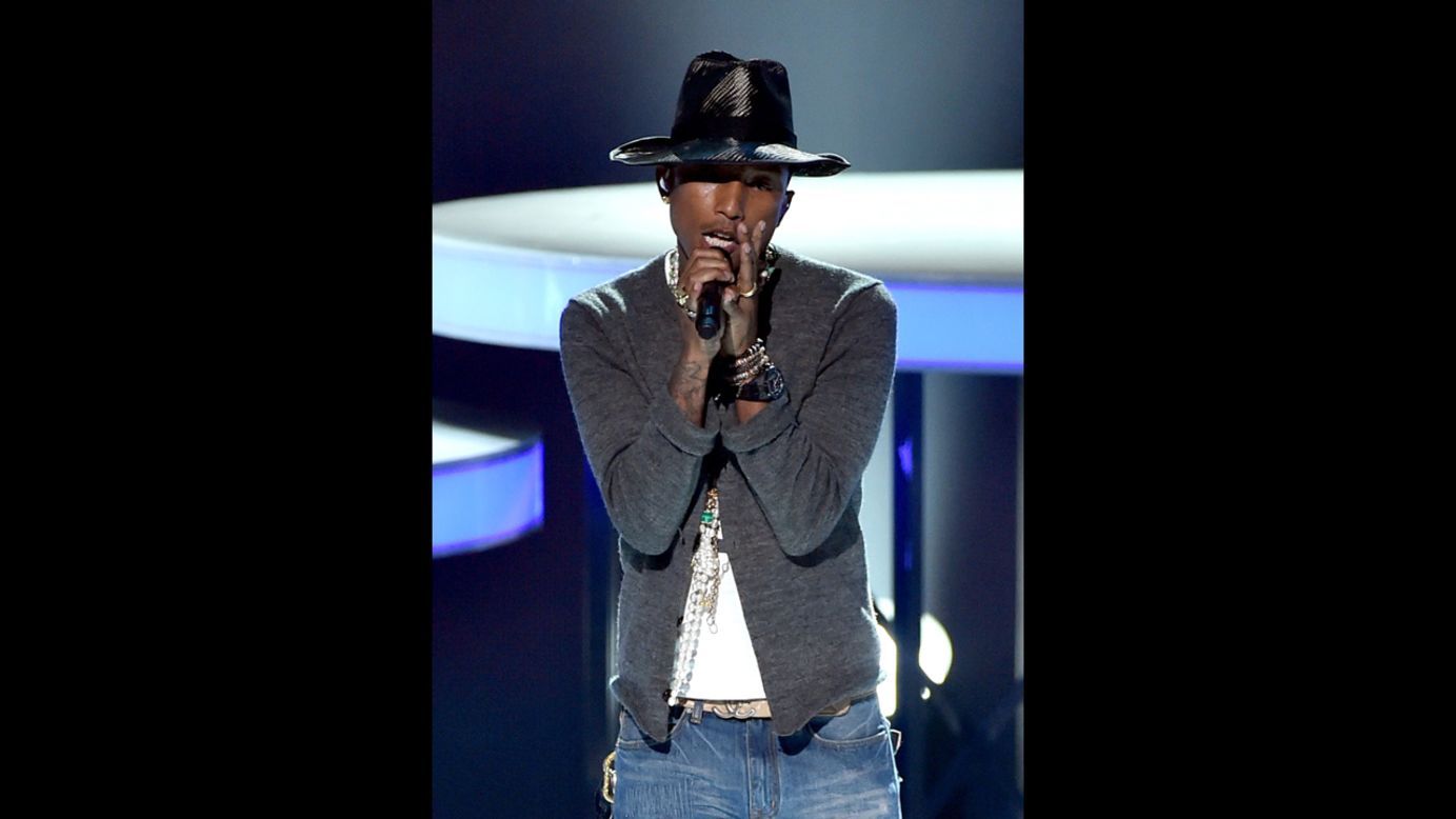 Pharrell Williams performs after winning an award. 