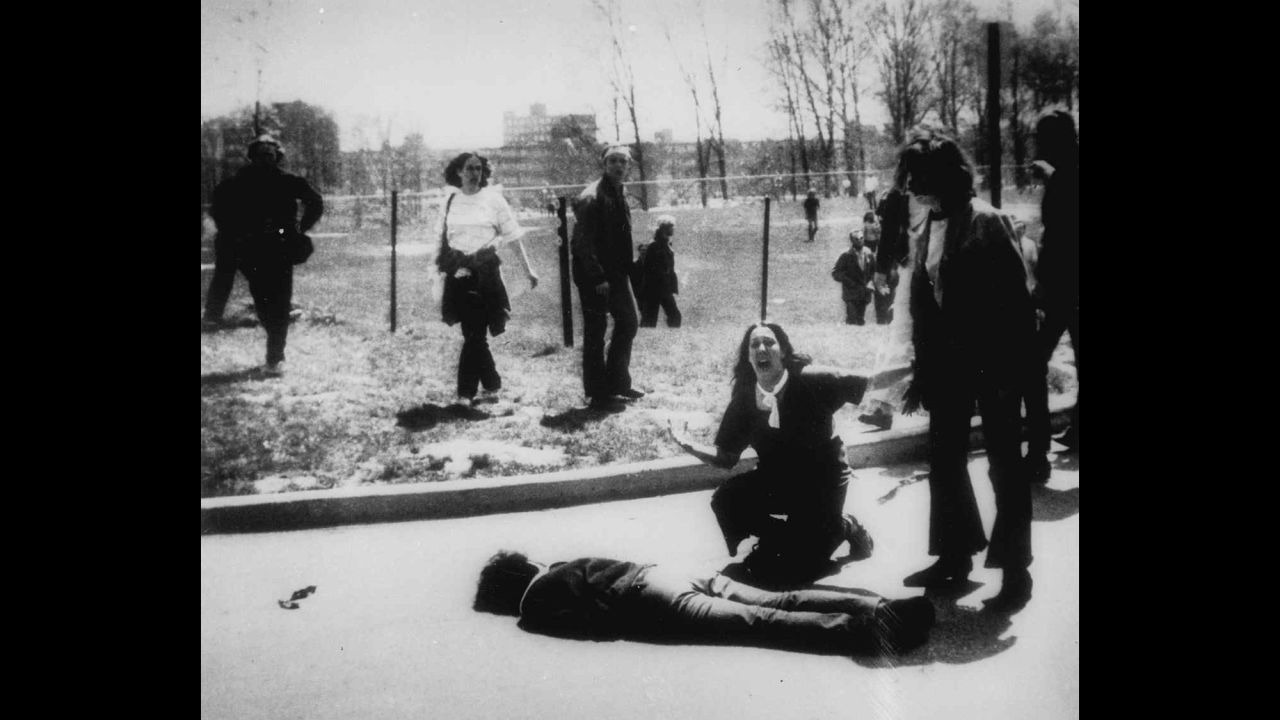 Four students died and nine others were wounded on May 4, 1970, when members of the Ohio National Guard opened fire on students protesting the Vietnam War at Kent State University in Ohio. In this Pulitzer Prize-winning photo, taken by Kent State photojournalism student John Filo, Mary Ann Vecchio can be seen screaming as she kneels by the body of a slain student.