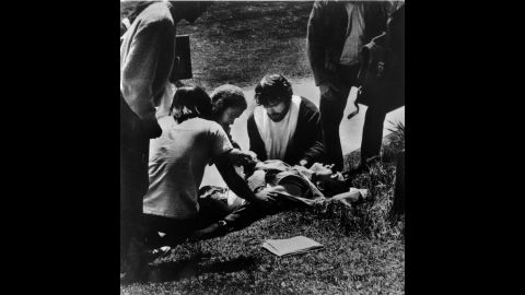 Kent State students gather around a wounded student. 