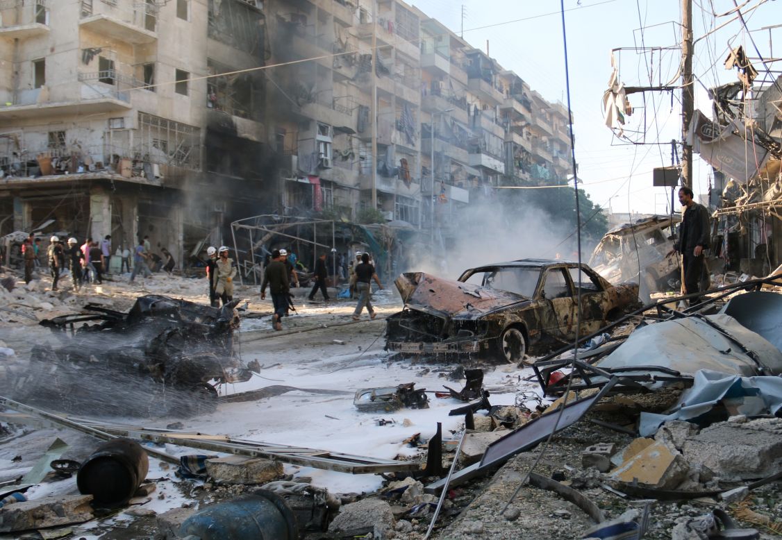 Syrians gather at the site of reported airstrikes in Aleppo on May 1. According to the Syrian Observatory for Human Rights, at least 33 civilians were killed in the attack.