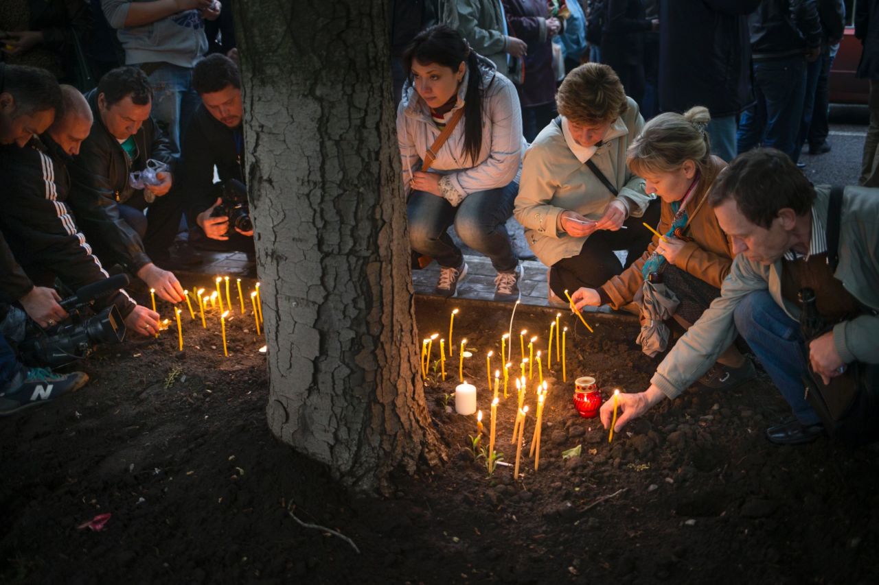 Pro-Russian protesters light candles in Donetsk on Saturday, May 3, to honor the memory of fallen comrades in Odessa.