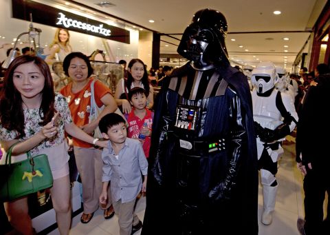 A member of the "Star Wars" fan club in Thailand, dressed as Darth Vader, parades with others to celebrate "Star Wars Day" at a shopping mall in Bangkok.