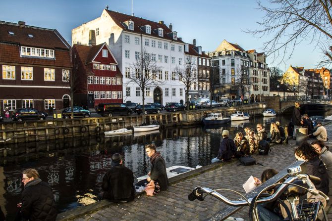 Pedestrians enjoy the weather in the Christians Havn district of Copenhagen, <strong>Denmark</strong>. The Danes enjoy the best work-life balance of all OECD countries, and also rank at the top in social connections. Denmark comes in at number four on the OECD list.<br /> 