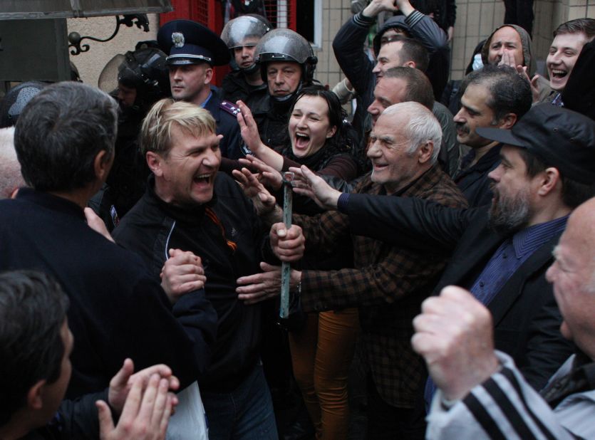 Pro-Russian militants who were arrested during a Ukrainian unity rally are greeted on Sunday, May 4, after being freed by police in Odessa. The men released Sunday had been detained after bloody clashes in Odessa, which ended in a deadly blaze. Forty-six people were killed in the bloodshed.