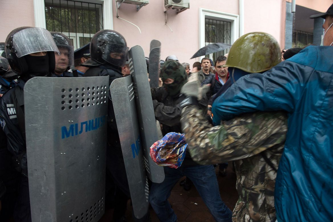 Pro-Russian militants clash with police as they storm the police station in Odessa on May 4.