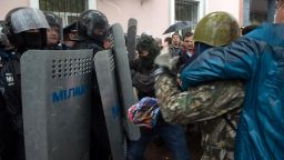 Pro-Russian militants clash with police as they storm the Odessa police station on May 4 to free the Pro-Russian activists arrested on May 2 after their attack of a Ukrainian unity rally.