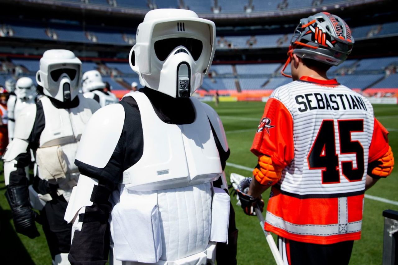 "Star Wars" fans dress in costume on May the 4th annually as a play on the phrase "May the force be with you." Here, stormtroopers cross paths with lacrosse player Domenic Sebastiani of the Denver Outlaws before a game against the Ohio Machine in Denver, Colorado. The teams wore "Star Wars"-themed jerseys. Click through the gallery for more costumes.