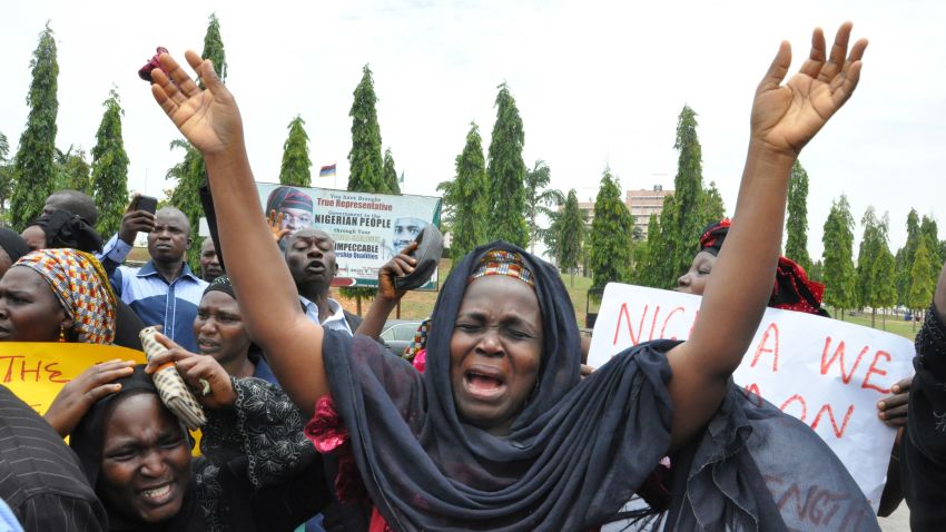 An unidentified mother cries out during a demonstration with others who have daughters among the kidnapped school girls of government secondary school Chibok, Tuesday April 29, 2014, in Abuja, Nigeria.  Two weeks after Islamic extremists stormed a remote boarding school in northeast Nigeria, more than 200 girls and young women remain missing despite a "hot pursuit" by security forces and desperate parents heading into a dangerous forest in search of their daughters. Some dozens have managed to escape their captors, jumping from the back of an open truck or escaping into the bush from a forest hideout, although the exact number of escapees is unclear. (AP Photo/ Gbemiga Olamikan)