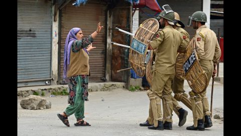 A Kashmiri Muslim woman confronts Indian police after they arrested a youth during a protest in Srinagar on May 2.