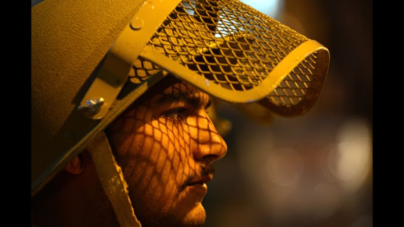 A police officer patrols during curfew in the Maisuma locality of Srinagar, India, on Friday, May 2.
