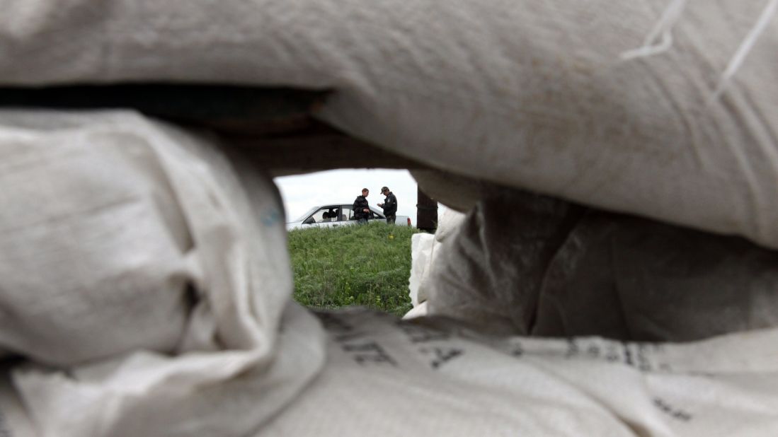 Ukrainian policemen check documents at a checkpoint near the northeastern city of Izium on May 5.