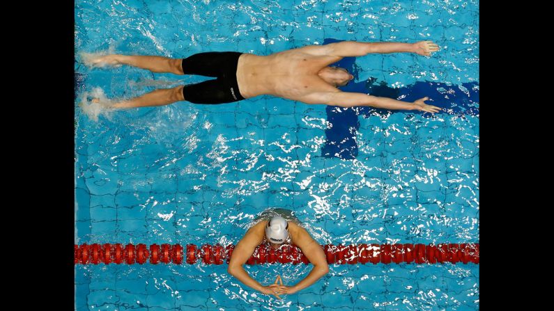 Nicolas Graesser, top, starts a 100-meter backstroke heat on Sunday, May 4, during the German Swimming Championships in Berlin.
