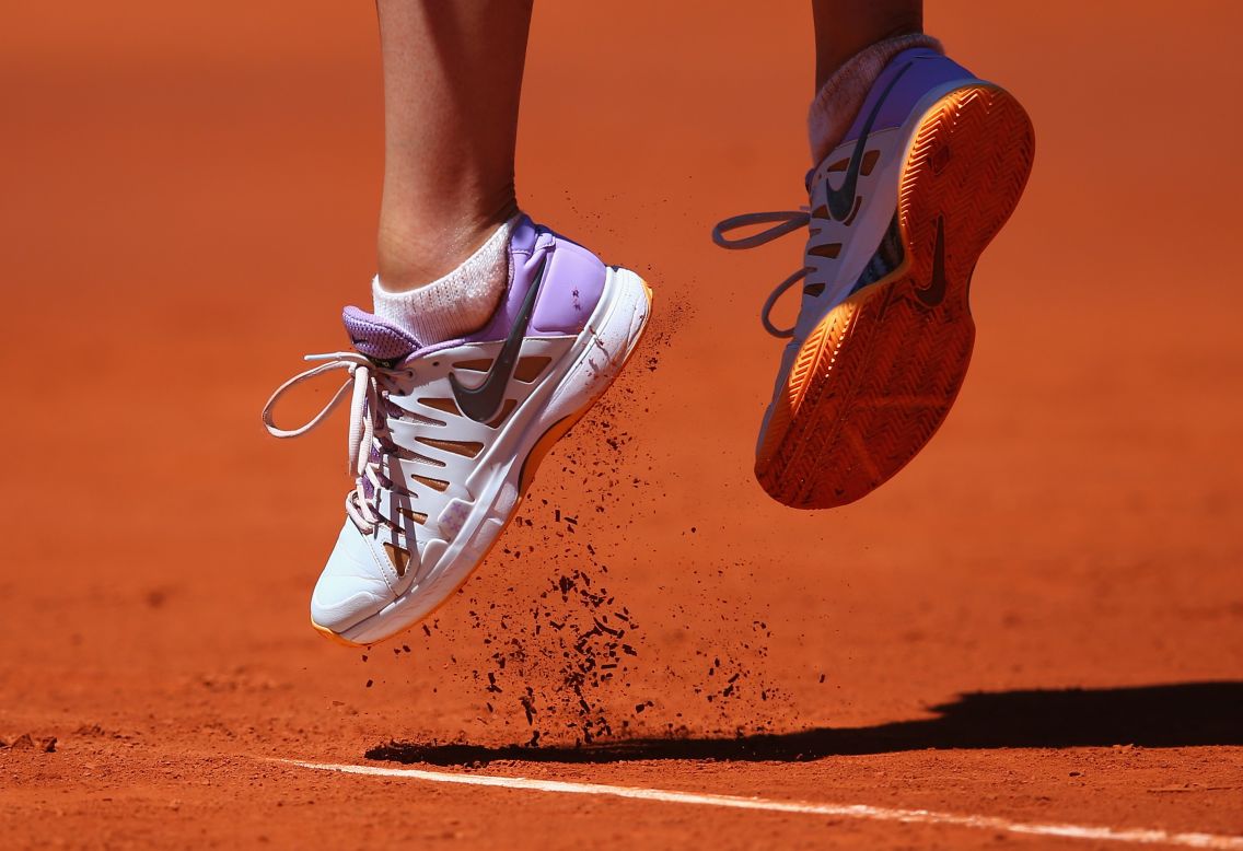 Pro tennis player Maria Sharapova jumps to deliver a serve during the Madrid Open on Sunday, May 4. She beat Klara Koukalova 6-1, 6-2 in the first-round match.