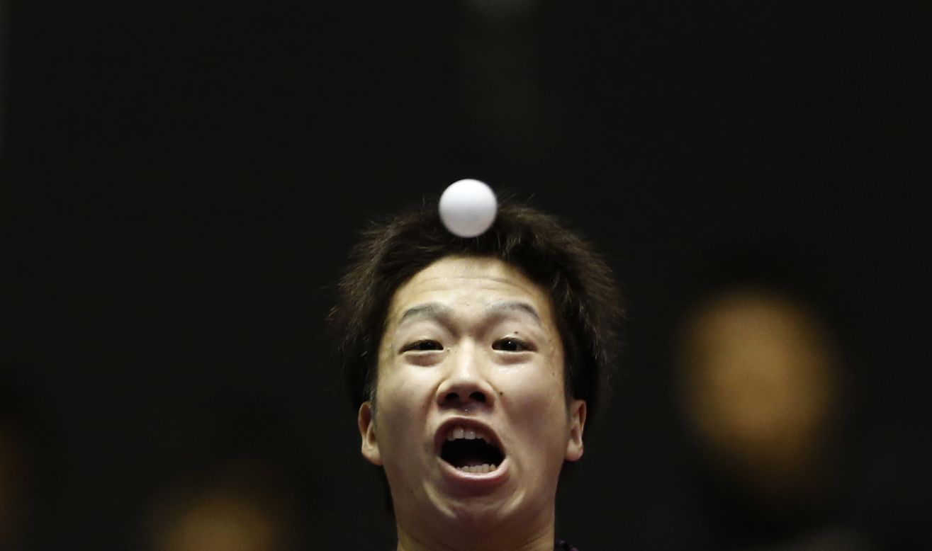 Japan's Jun Mizutani eyes the ball as he hits a return during a match at the World Team Table Tennis Championships in Tokyo on Tuesday, April 29. China eventually won both the men's and women's competitions.
