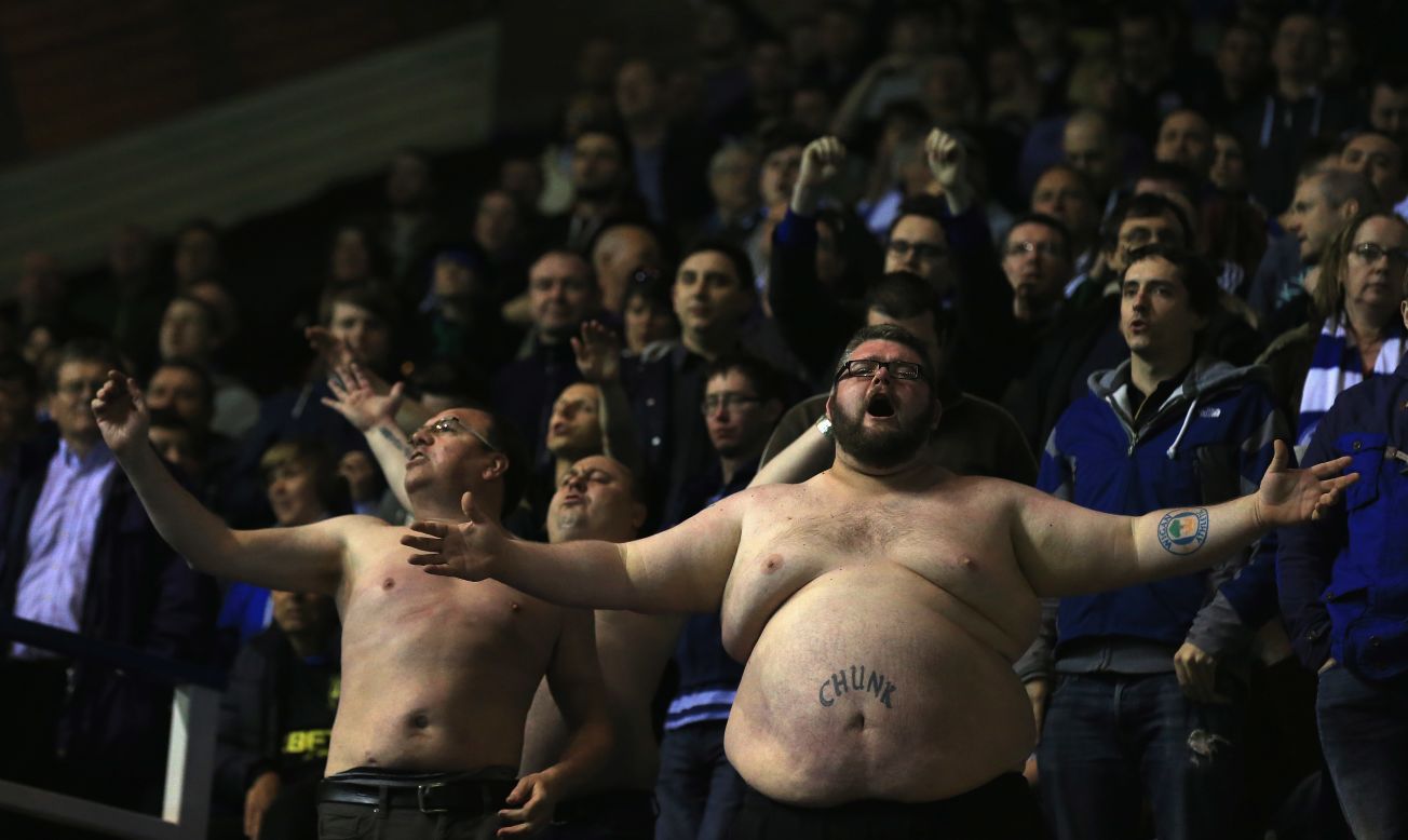 Two shirtless supporters of the Wigan Athletic soccer club are seen during Wigan's match at Birmingham City on Tuesday, April 29. Wigan won the match 1-0 to clinch a playoff spot in the the second division of English soccer.