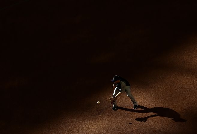 Justin Morneau of the Colorado Rockies fields a ground ball as he warms up for a Major League Baseball game against the Arizona Diamondbacks on Wednesday, April 30, in Phoenix.