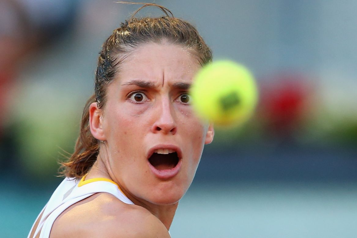 Andrea Petkovic focuses on the tennis ball during her first-round match in the Madrid Open on Saturday, May 3. She lost to Sara Errani in straight sets.
