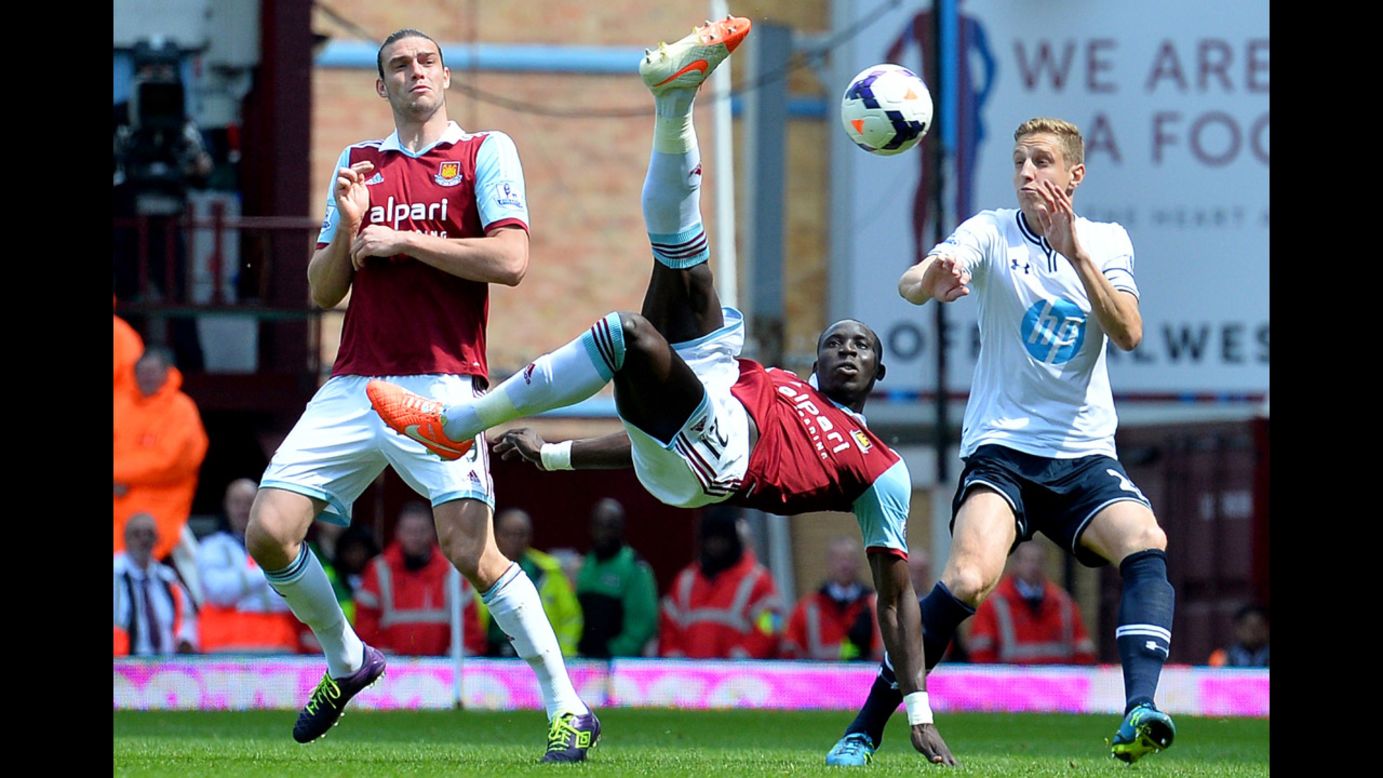 West Ham United midfielder Mohamed Diame attempts an overhead kick during the English Premier League match against Tottenham Hotspur on Saturday, May 3, in London. West Ham won the home match 2-0 to ensure they would stay clear of the league's relegation zone this season.