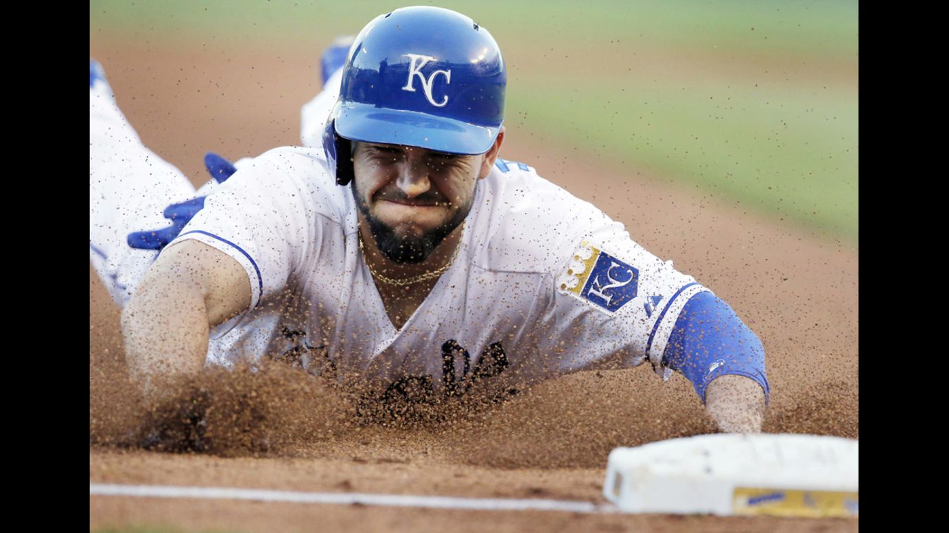 Eric Hosmer of the Kansas City Royals slides into third base during a Major League Baseball game against the Detroit Tigers on Saturday, May 3, in Kansas City, Missouri. The Tigers won the game 9-2.