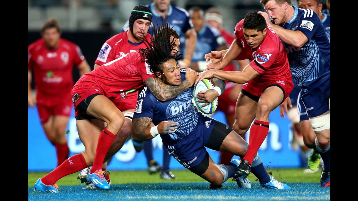 Ma'a Nonu of the Blues is tackled Friday, May 2, during a Super Rugby match against the Queensland Reds in Auckland, New Zealand. The Blues triumphed 44-14.