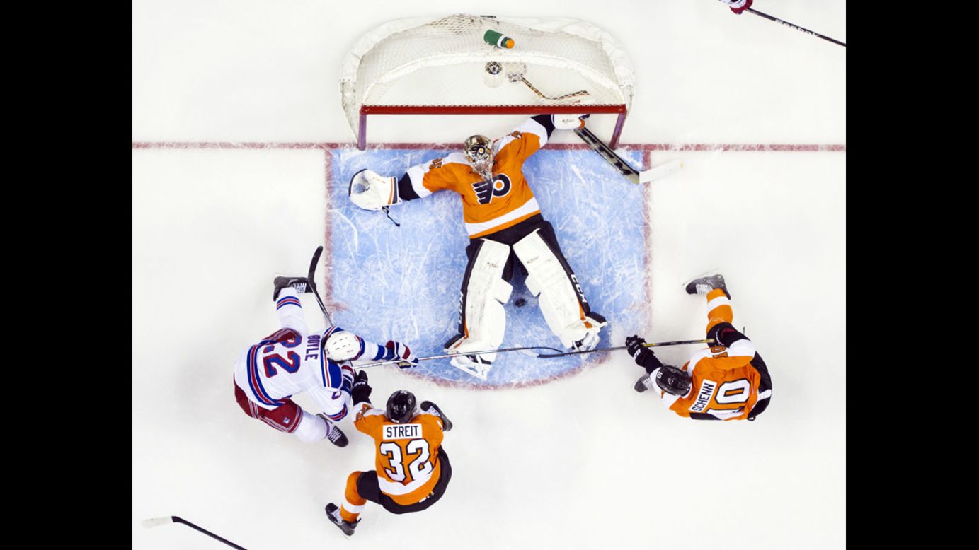 Philadelphia Flyers goalie Steve Mason tries to keep the puck between his legs during Game 6 of the NHL playoff series against the New York Rangers on Tuesday, April 29. The Flyers won the game 5-2 but lost the deciding Game 7 to end their season. 