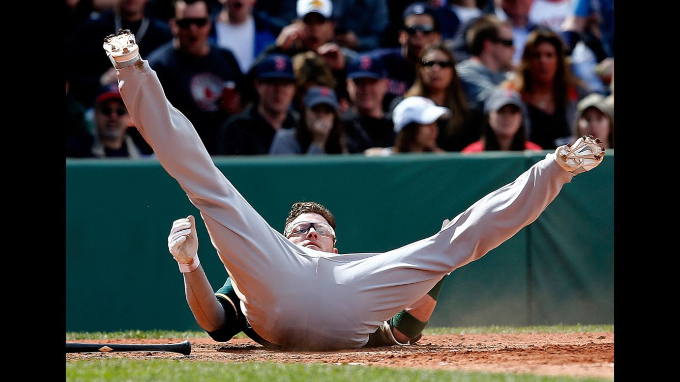 Oakland's Josh Donaldson lands on his back after a close pitch Sunday, May 4, during a Major League Baseball game in Boston. Oakland won the game 3-2.