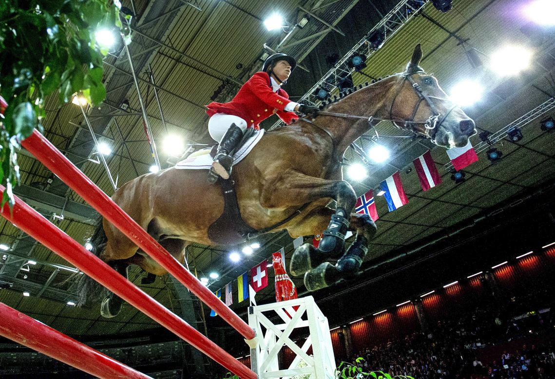 Beezie Madden of the U.S. and her horse Simon ride to glory at the FEI World Cup jumping final at the Gothenburg Horse Show in Sweden in April 2013.
