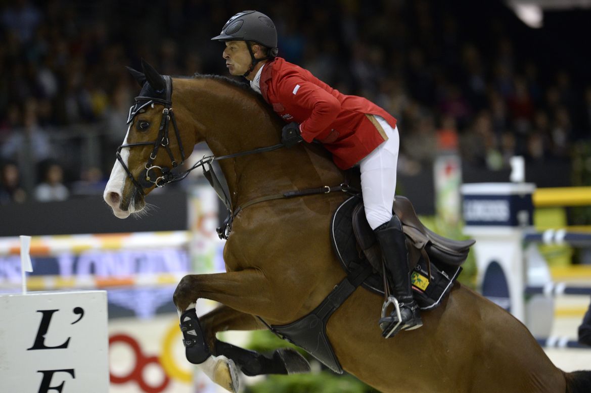 Schwizer competes on horse Toulago during the jumping final at the FEI World Cup jumping and dressage finals in Chassieu, France.