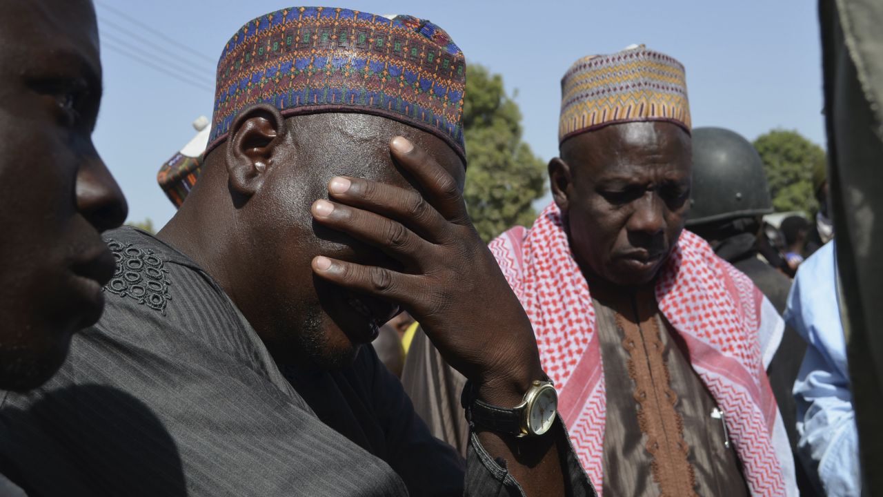 FILE: A man weeps at a meeting in Borno State in April called over previous abductions by insurgents.