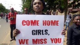 A woman carries placard to press for the release of missing Chibok school girls during a rally by civil society in Lagos on May 5, 2014.
