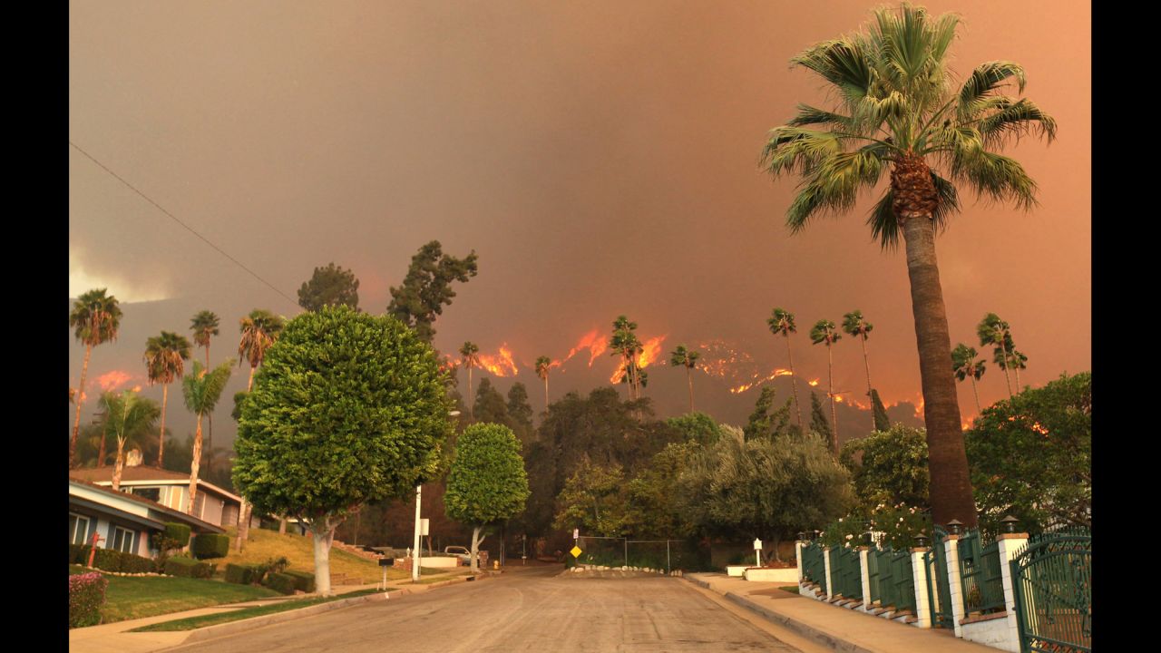 The report breaks the country down by region and identifies specific threats should climate change continue. Major concerns cited by scientists involved in creating the report include rising sea levels along America's coasts, drought in the Southwest and prolonged fire seasons. In this image from January 16, a wildfire burns in the hills just north of the San Gabriel Valley community of Glendora, California.