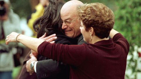 Lewinsky's father, Bernard, hugs her in front of his home in Brentwood, California, in 1998.
