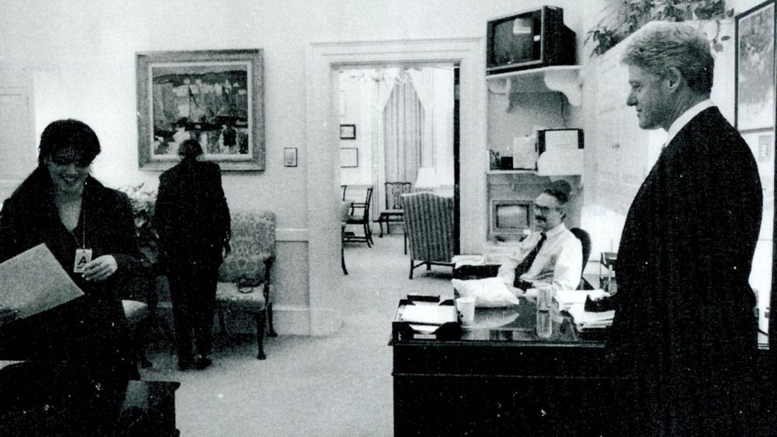 Another photograph submitted as evidence shows Lewinsky working in the White House office as President Clinton looks on.