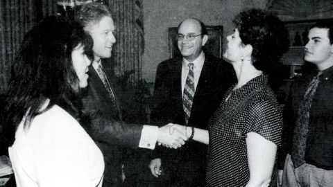 Lewinsky, far left, is seen with President Clinton at the White House.