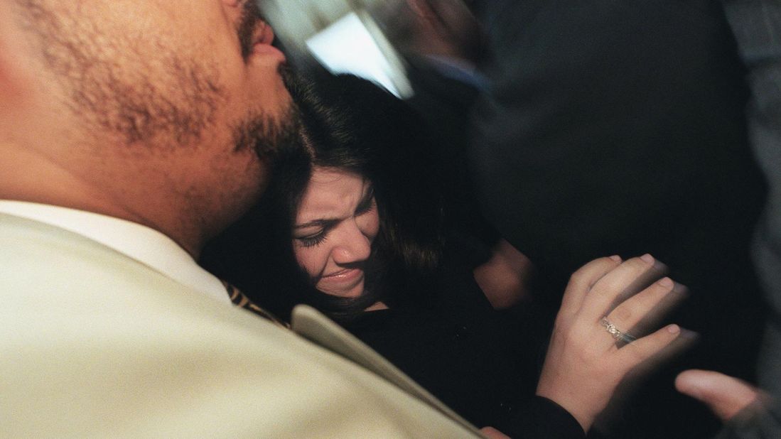 Lewinsky is pushed in a crowd of reporters after meetings with her attorneys in Washington in 1999.