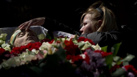 A relative mourns by the body of 17-year-old Vadim Papura during a service in Odessa on May 6. Papura died after jumping out of a burning trade union building during riots on May 2.