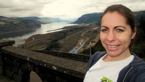 The goal of visiting all 50 states is a tradition in Holly Kearl's family. The Virginia resident, 31, recently capped off her quest in Alabama. Kearl is pictured here in 2012 in the Crown Point State Scenic Corridor outside Portland, Oregon.