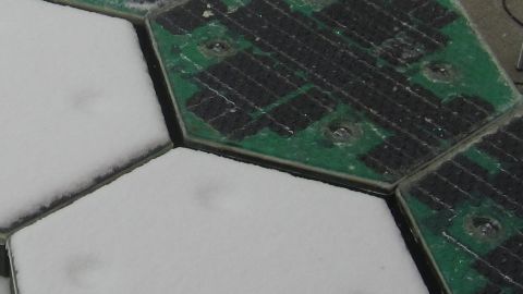This invention could allow roads to be quickly cleared of snow. The panels on the right are switched on, and the left ones switched off.