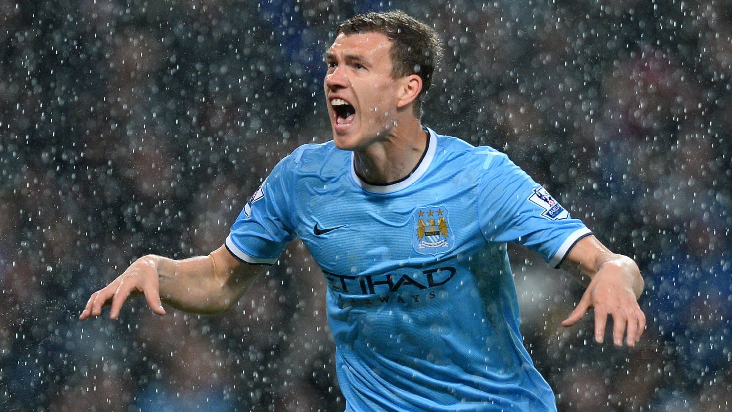 Edin Dzeko scored twice as Manchester City moved to within touching distance of the Premier League title.